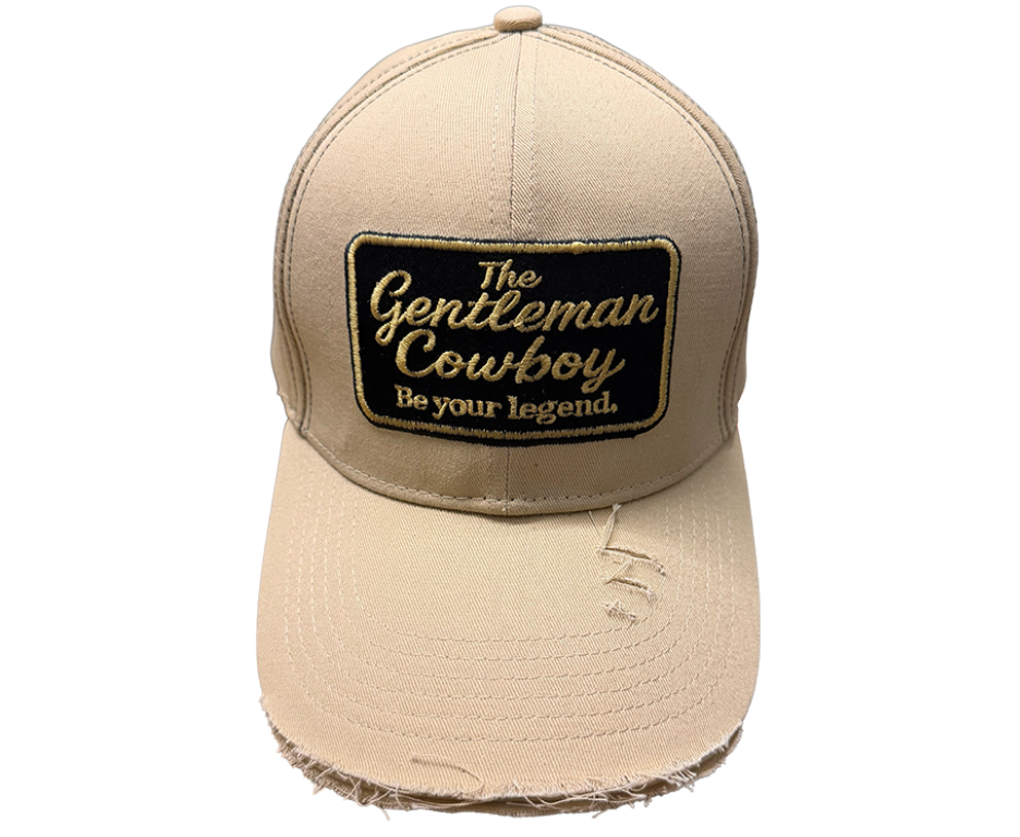 Beige cap with 'The Gentleman Cowboy' logo on a white background