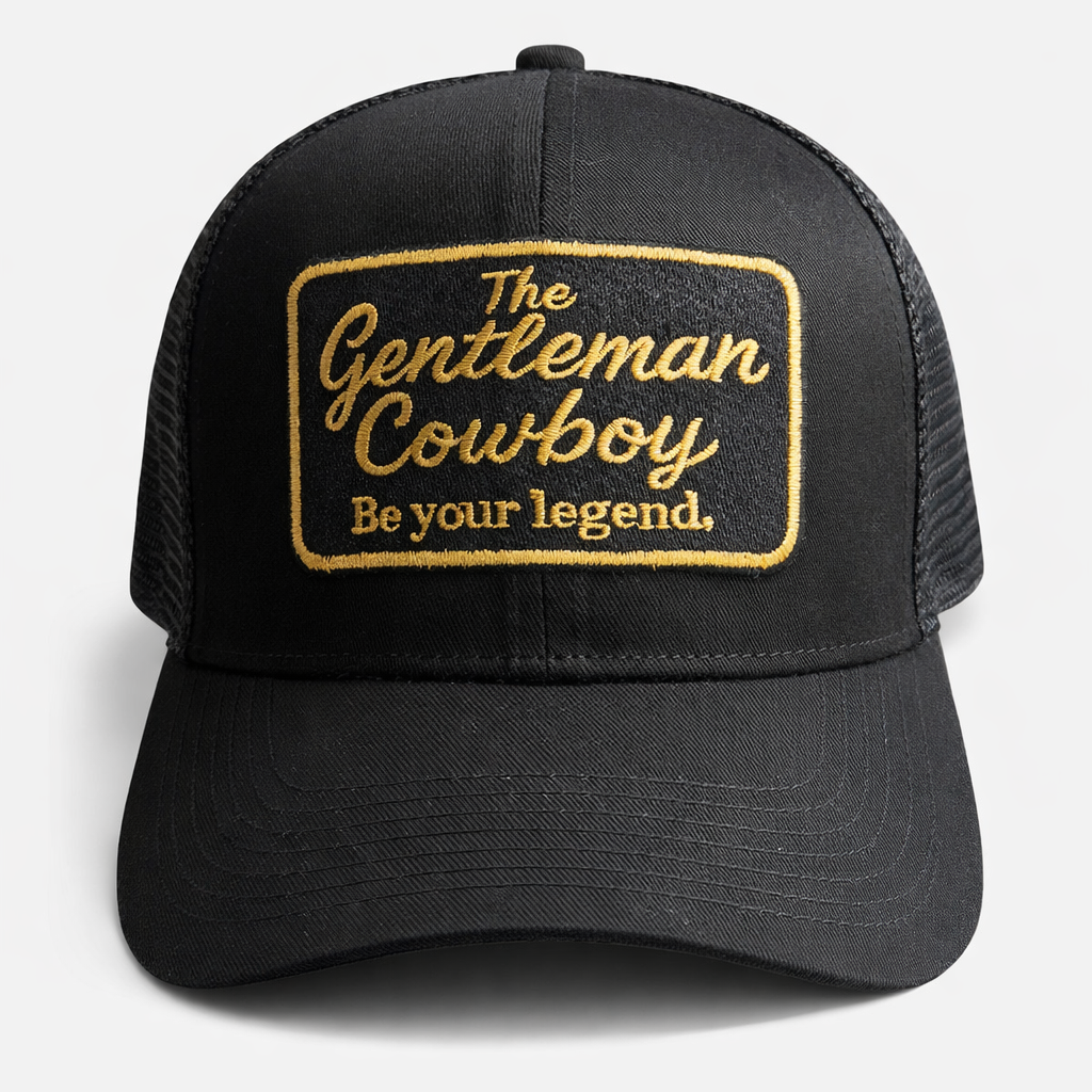Black trucker hat with gold text on a white background