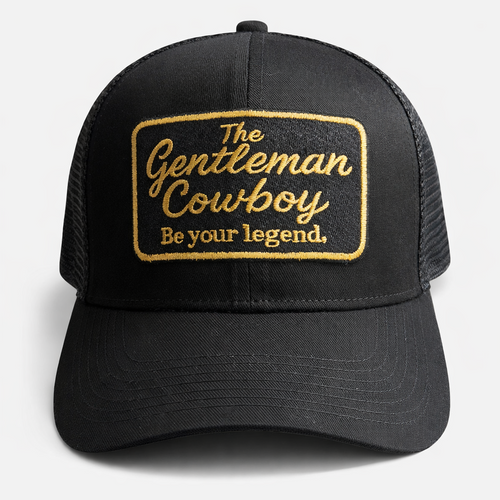 Black trucker hat with gold text on a white background